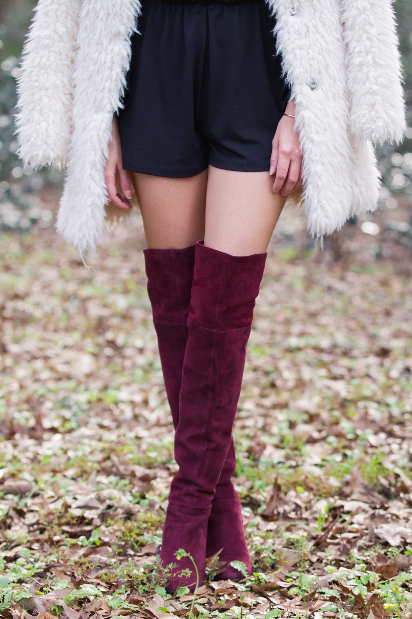 how to wear a romper in the winter, how to style a romper for winter, furry coat, big fuzzy coat, burgundy over the knee boots, chic winter style