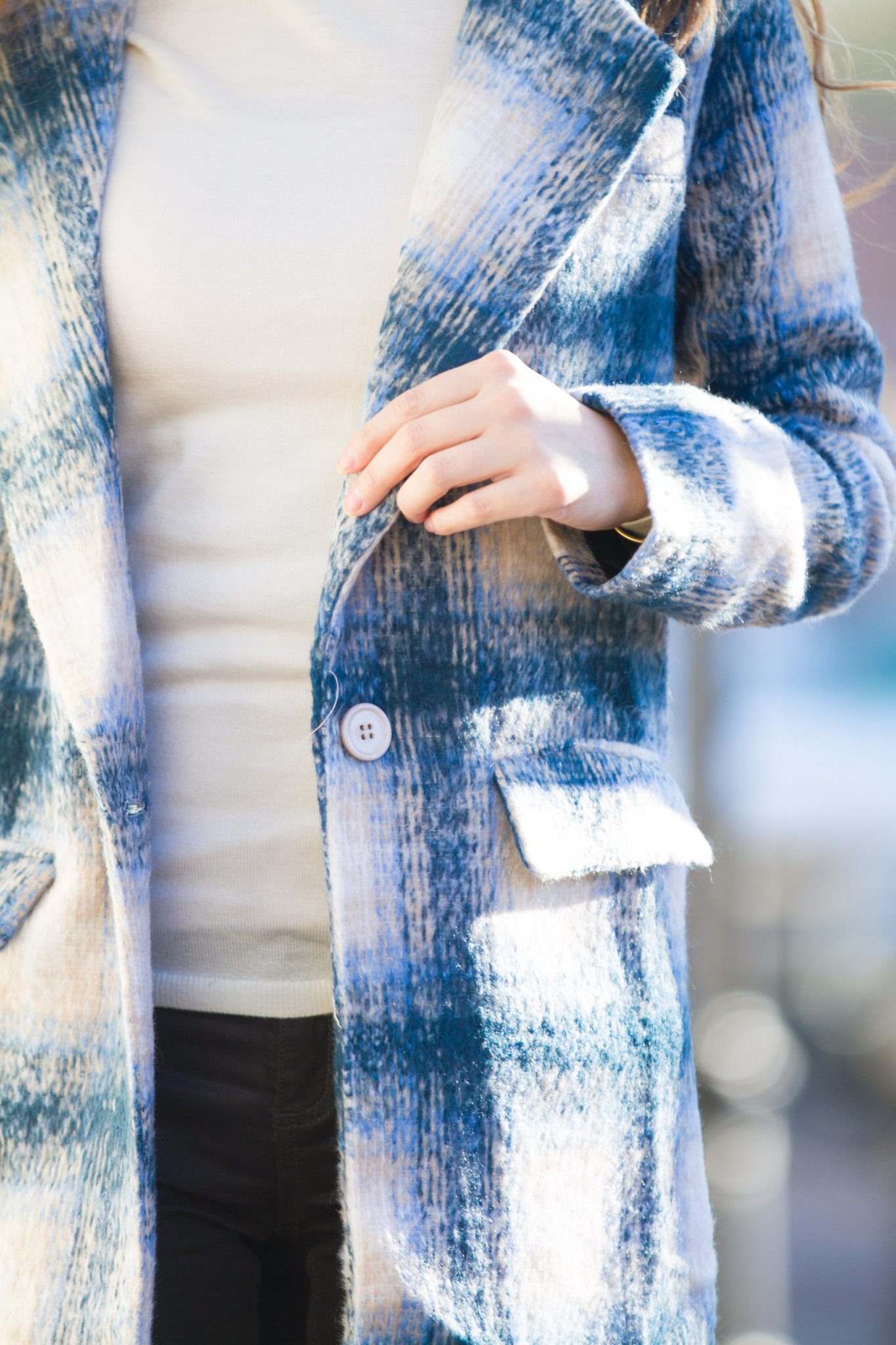 classic check coat, winter style, ivory turtleneck, wax-coated jeans