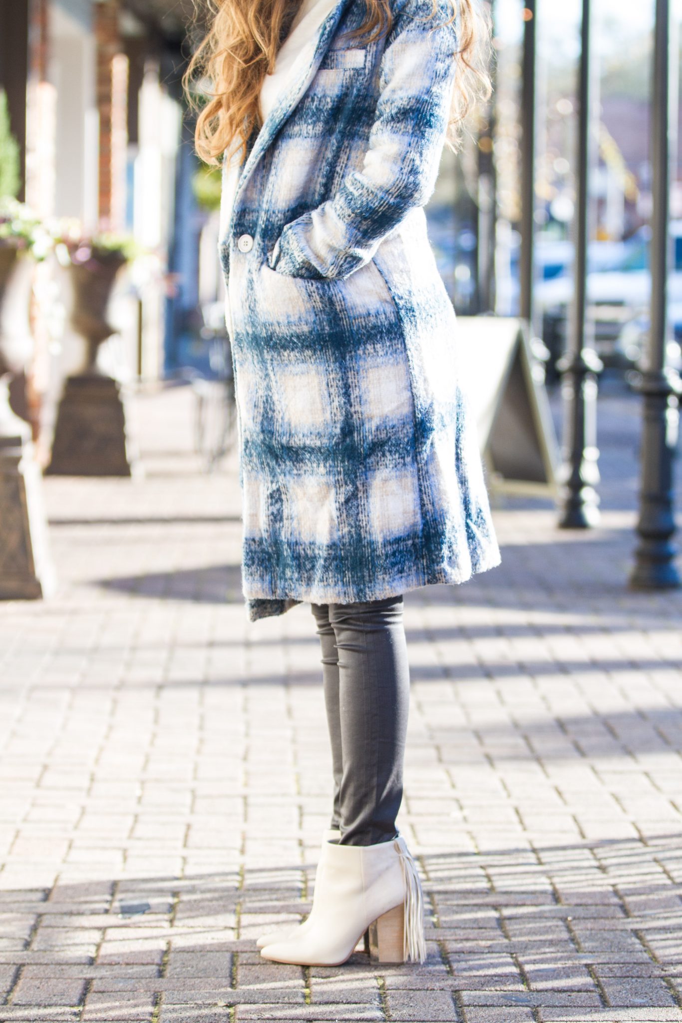 classic check coat, winter style, ivory turtleneck, wax-coated jeans