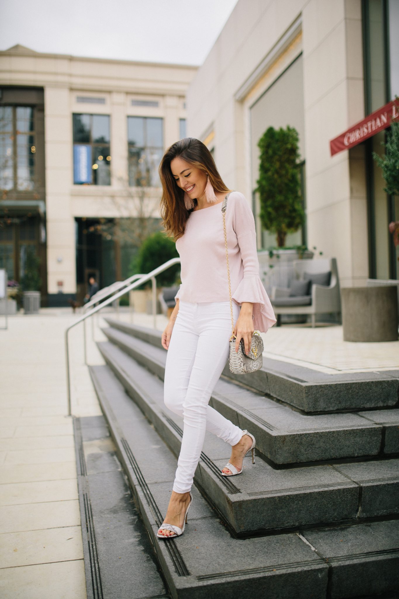 light pink in winter, wearing white in winter, light pink and white, bell sleeve sweater, feather earrings, snakeskin bag, taxidermy handbags, wearing light colors in winter